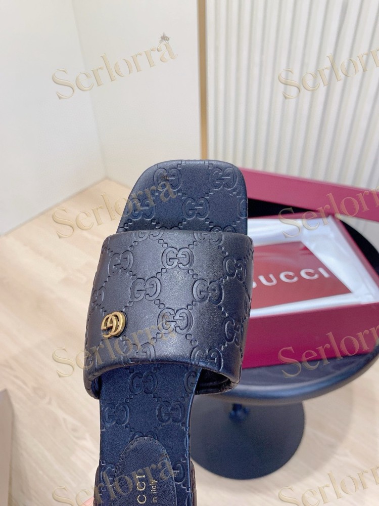 GUCCI ALL-OVER GG EMBOSSED LEATHER DOUBLE G SLIDE SANDALS