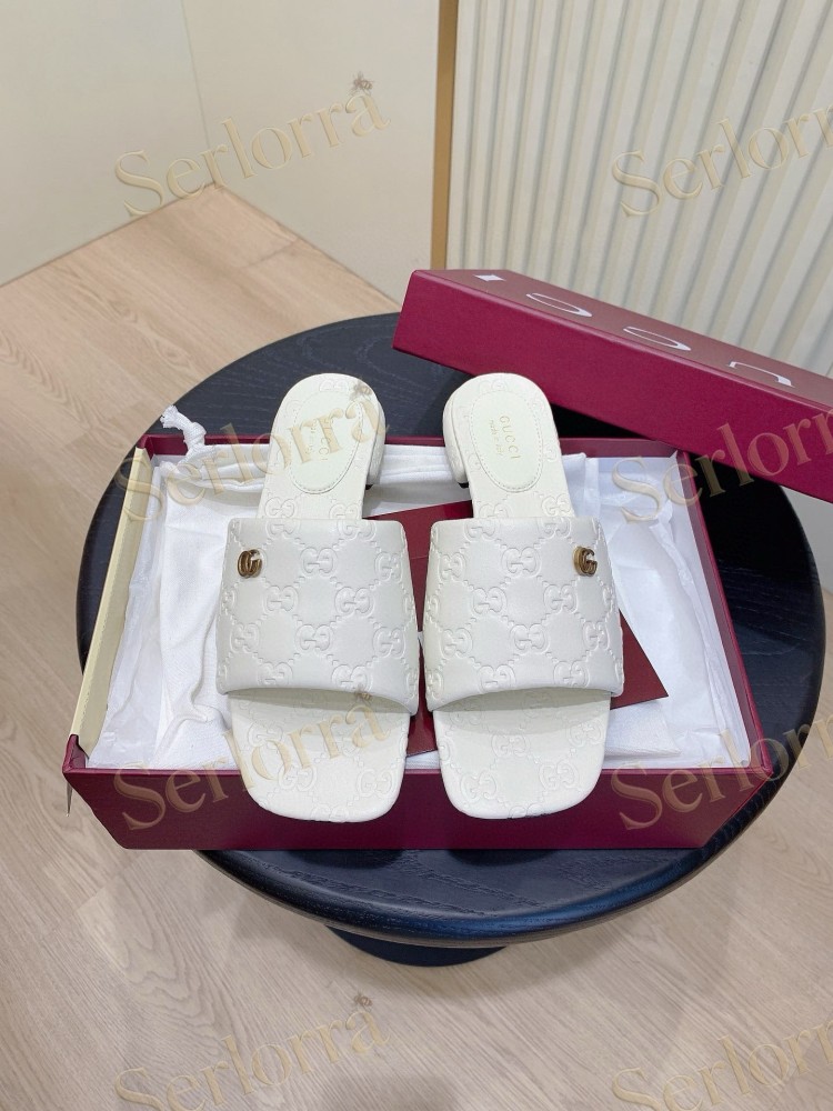 GUCCI ALL-OVER GG EMBOSSED LEATHER DOUBLE G SLIDE SANDALS