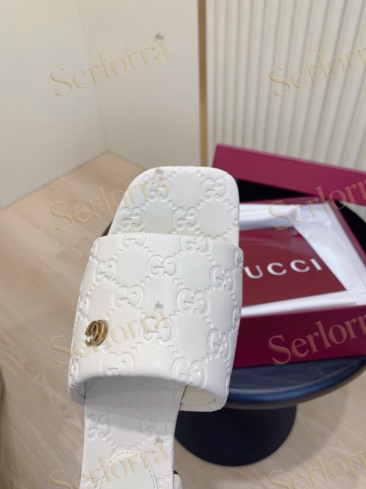 GUCCI ALL-OVER GG EMBOSSED LEATHER DOUBLE G SLIDE SANDALS