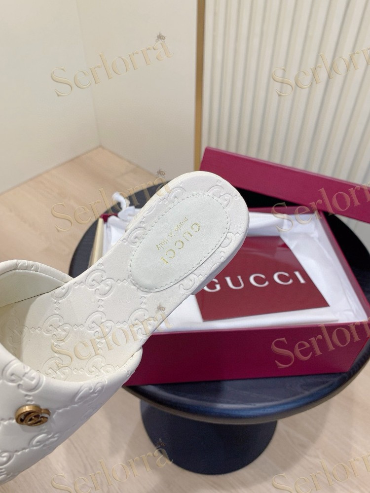 GUCCI ALL-OVER GG EMBOSSED LEATHER DOUBLE G SLIDE SANDALS