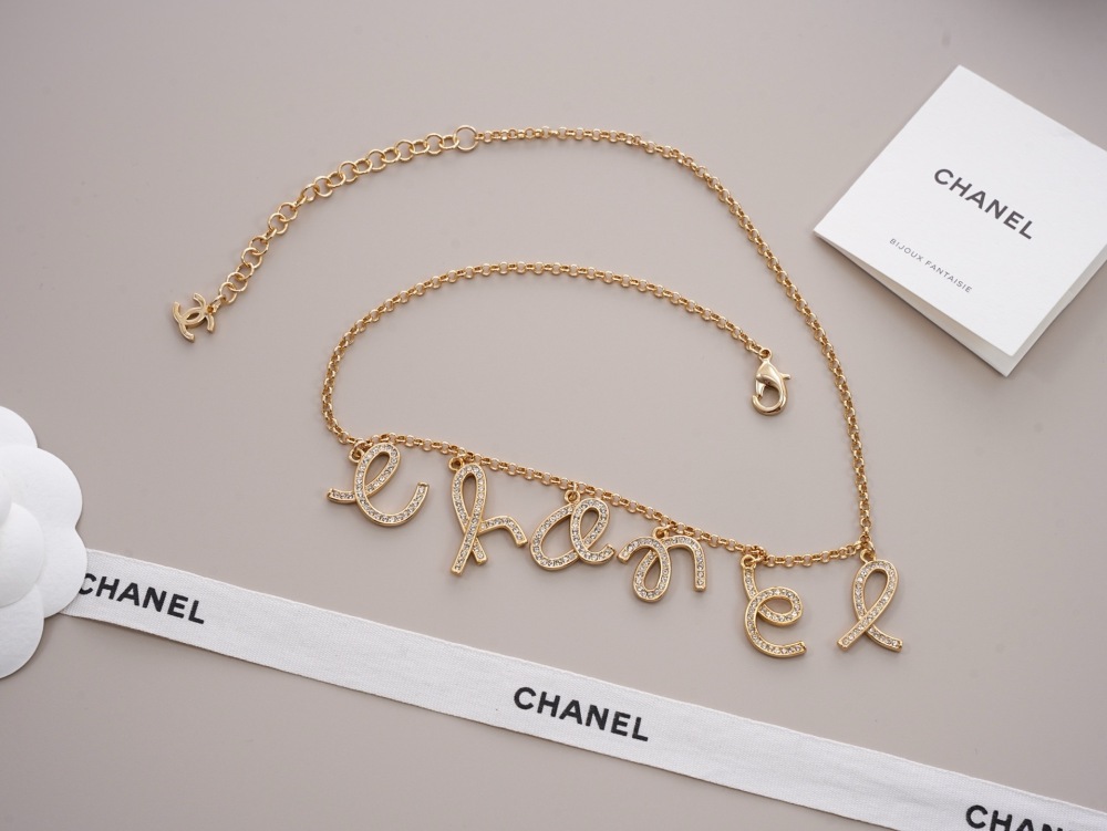 CHANEL SCRIPT LETTER CHARM CHAN‑EL NECKLACE