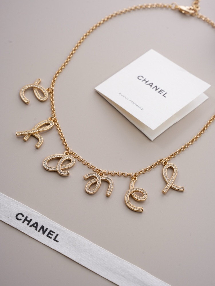 CHANEL SCRIPT LETTER CHARM CHAN‑EL NECKLACE