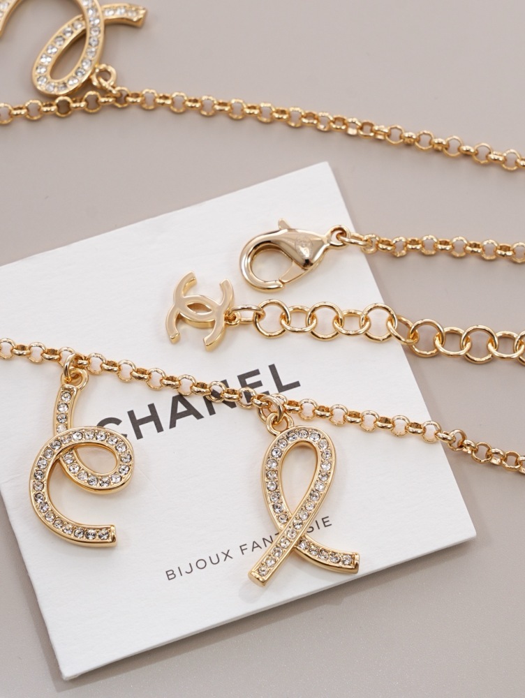 CHANEL SCRIPT LETTER CHARM CHAN‑EL NECKLACE