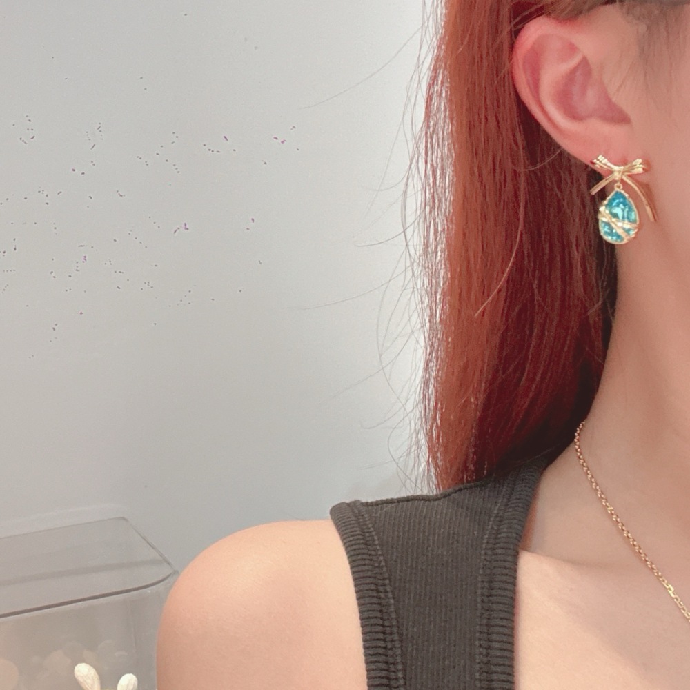 DIOR BOW TEARDROP CRYSTAL DROP EARRINGS, GOLD-TONE WITH AQUA BLUE STONE