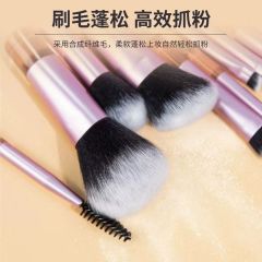 Makeup brush set with crystal handle, including powder brush, contour brush, blush brush, and eyeshadow brush. 10 brushes in a portable set.
