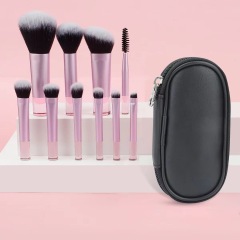Makeup brush set with crystal handle, including powder brush, contour brush, blush brush, and eyeshadow brush. 10 brushes in a portable set.