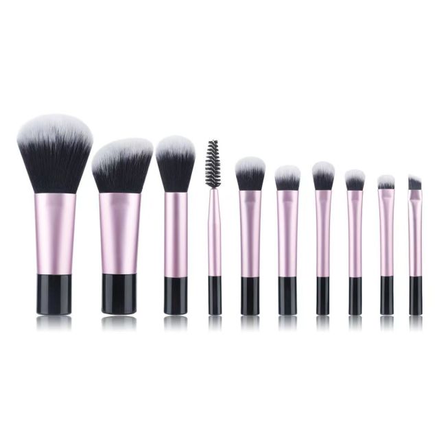 Makeup brush set with crystal handle, including powder brush, contour brush, blush brush, and eyeshadow brush. 10 brushes in a portable set.