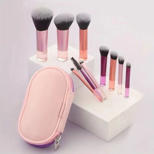 Makeup brush set with crystal handle, including powder brush, contour brush, blush brush, and eyeshadow brush. 10 brushes in a portable set.