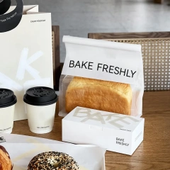 Flat-bottom toast bag with clear window, folded paper box and coffee cups for bakery branding