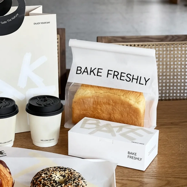 Flat-bottom toast bag with clear window, folded paper box and coffee cups for bakery branding