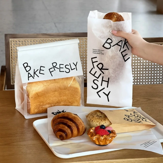 Toast bag with clear window, flat greaseproof paper bag and kraft pastry bag with baked goods
