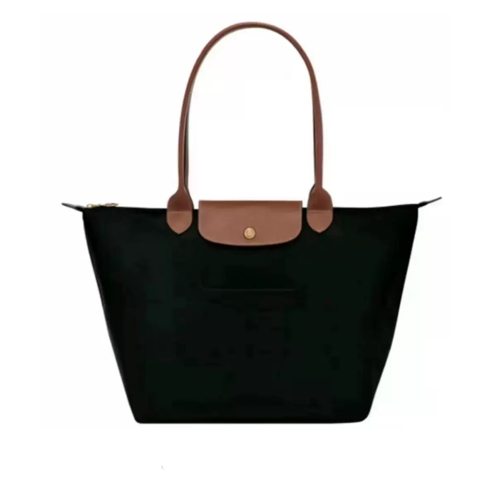LONGCHAMP medium tote bag with gold hardware, snap buttons, and zipper closure.