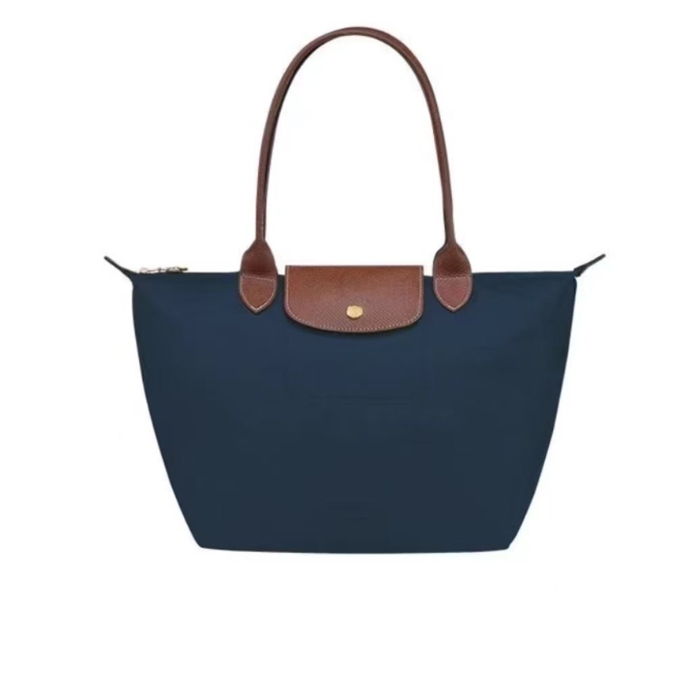 LONGCHAMP medium tote bag with gold hardware, snap buttons, and zipper closure.