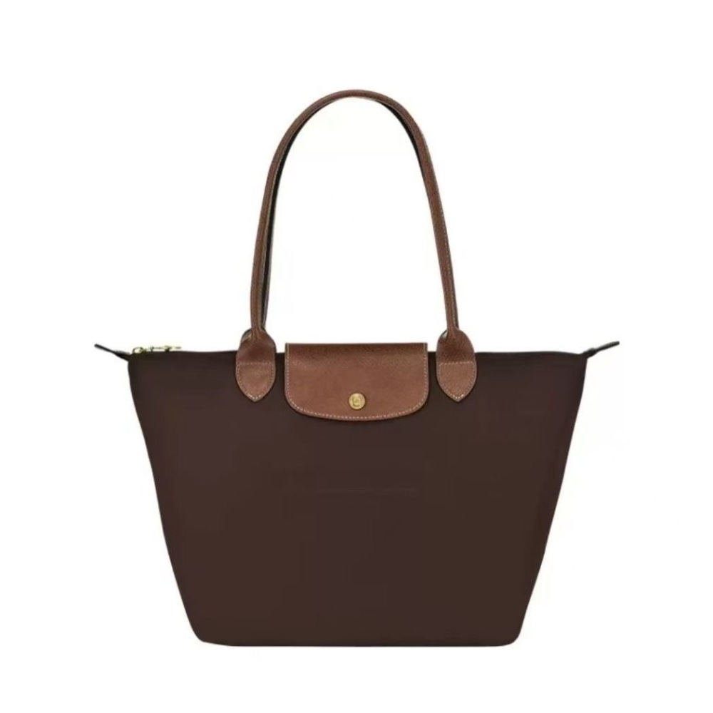 LONGCHAMP medium tote bag with gold hardware, snap buttons, and zipper closure.