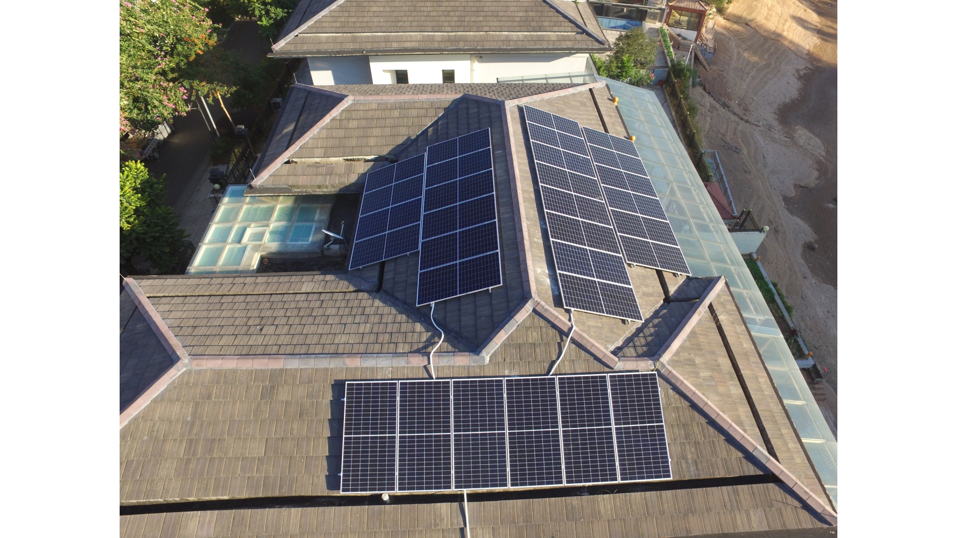 Hook and clamp attachment on tile roof