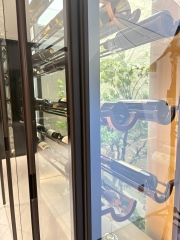 Column-supported Glass Wine Cabinet