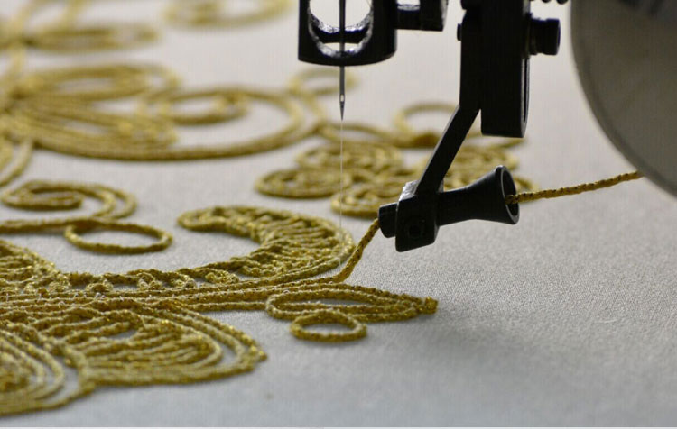 Floral cord embroidery sample with 3D cording effect on denim
