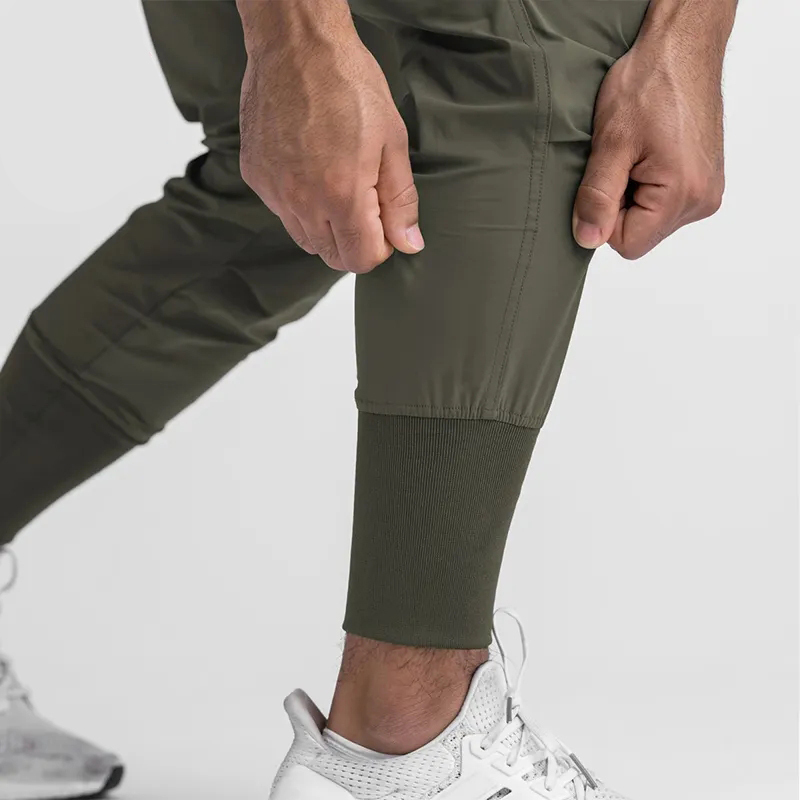 Custom High Quality Blank Polyester Sports Gym Activewear Fitness Slim Fit Nylon Skinny Mens Sweatpants Joggers Wtih Pockets
