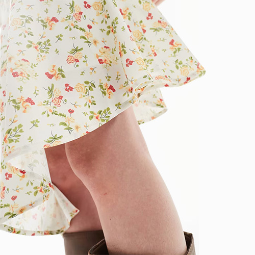 The Sky Chintz Floral Asymmetric Midi Skirt In White