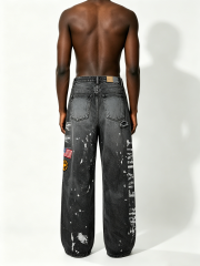 Custom Black Faded Wash Splatter Paint Military Patch Distressed Wide Leg Denim Jeans Manufacturer | Men Army Badge Ripped Baggy Grunge Streetwear Denim Pants Private Label, 50 MOQ, 7-Day Sample & 15-Day Bulk Lead Time