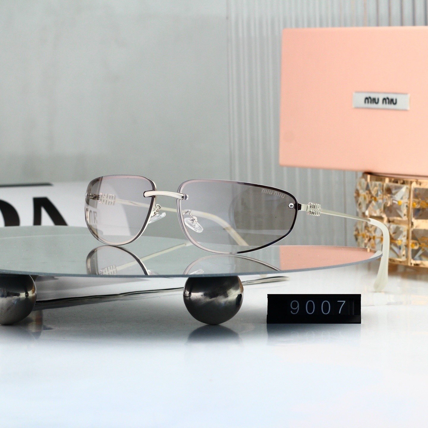 Miu Miu Signature Logo Narrow Rimless Oval Sunglasses 9007