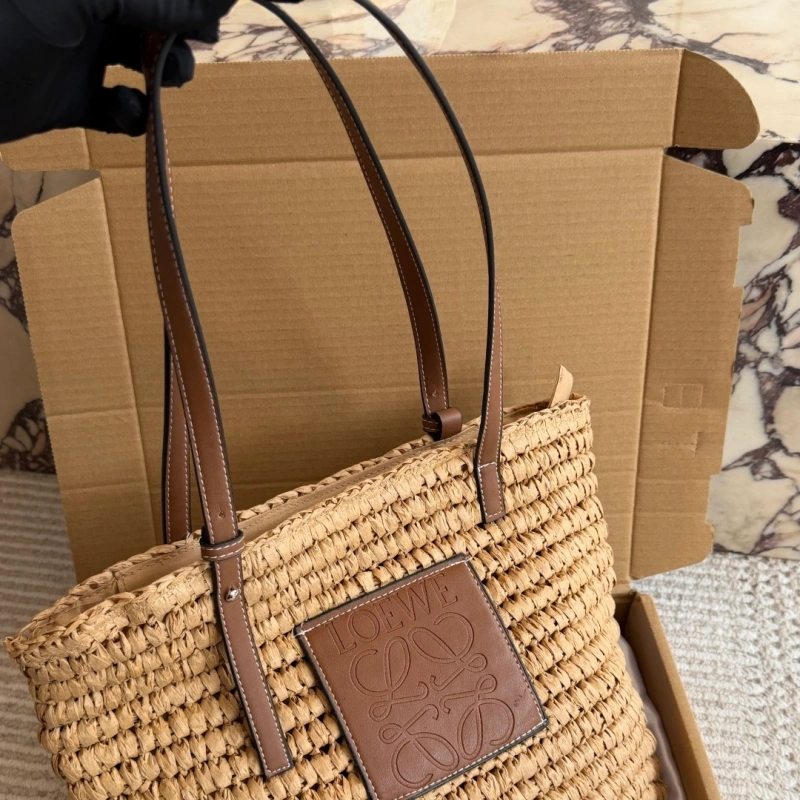 Summer is here, and you’re still not rocking this stunning straw bag-box