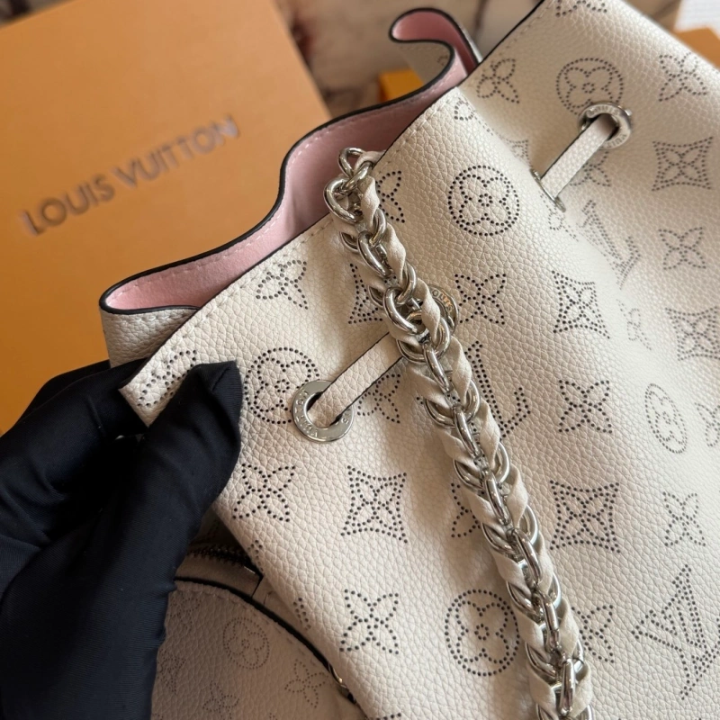 Crafted from calfskin, this is a compact bucket bag-box
