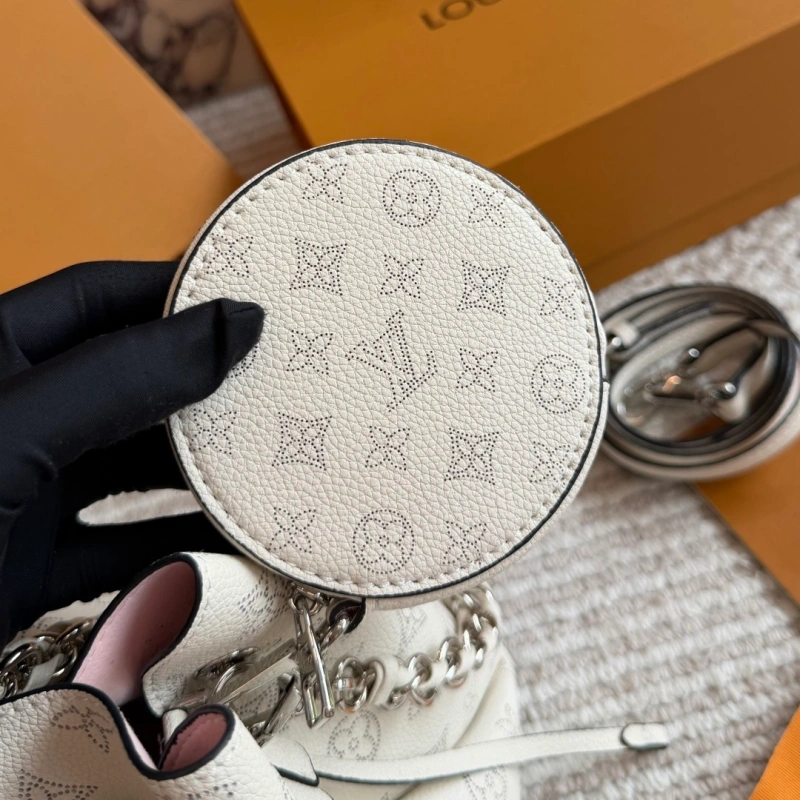 Crafted from calfskin, this is a compact bucket bag-box
