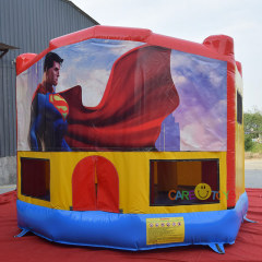 bounce house with Superman art pannel
