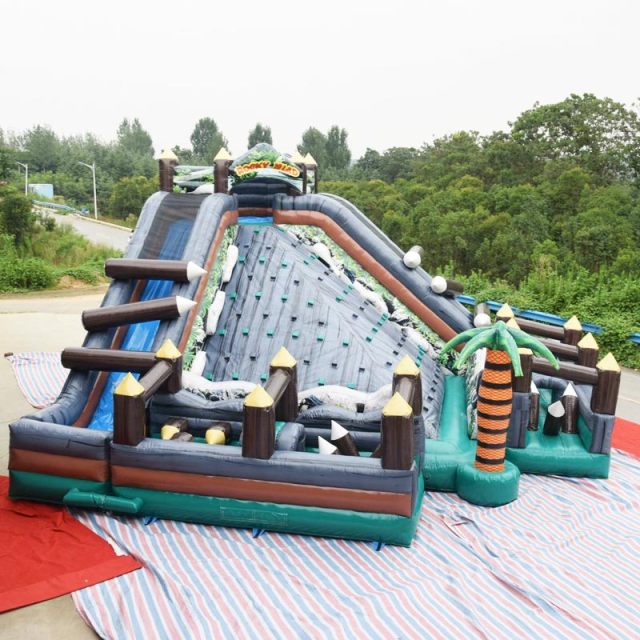 rocky island obstacle course with rock climbing slide