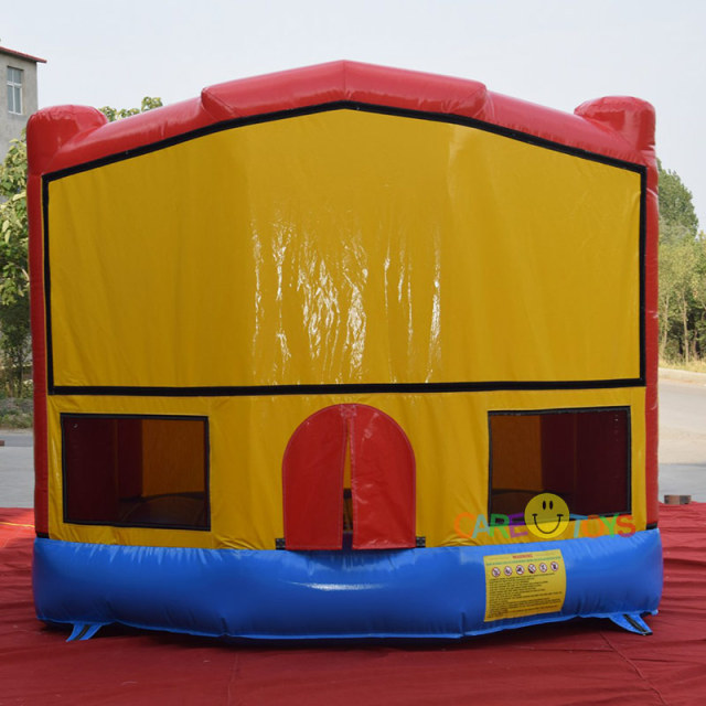 bounce house with Superman art pannel