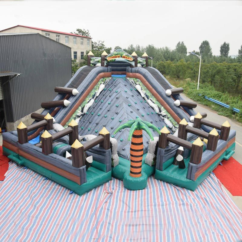 rocky island obstacle course with rock climbing slide