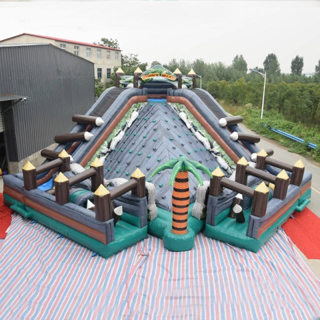 rocky island obstacle course with rock climbing slide