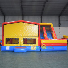 Inflatable moonwalker with slide