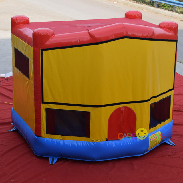 bounce house with Superman art pannel