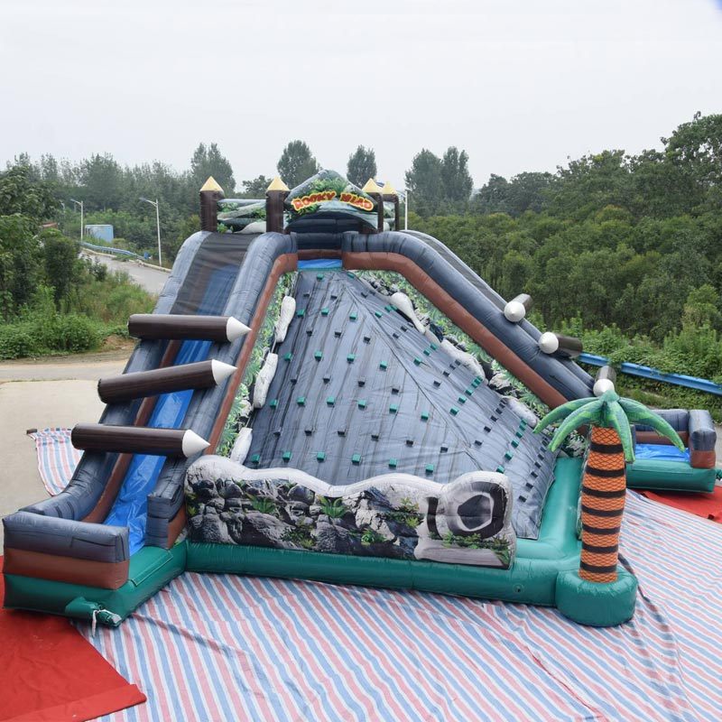 rocky island obstacle course with rock climbing slide