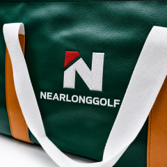 Embroidered logo detail on green golf weekend bag