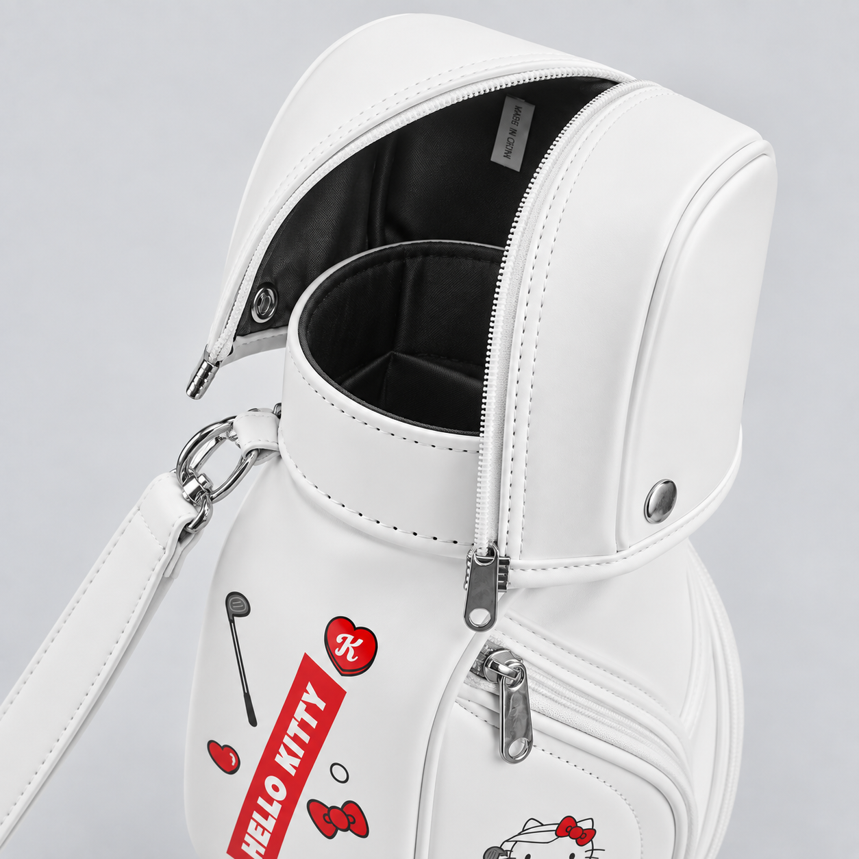 Compact women's golf carry bag with padded interior and zippered club cover