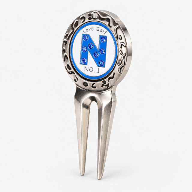 Metal golf divot repair tool with removable ball marker