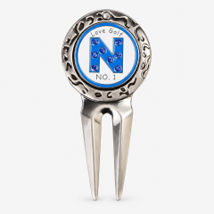 Vintage two prong golf divot tool with custom ball marker