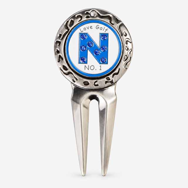 Vintage two prong golf divot tool with custom ball marker