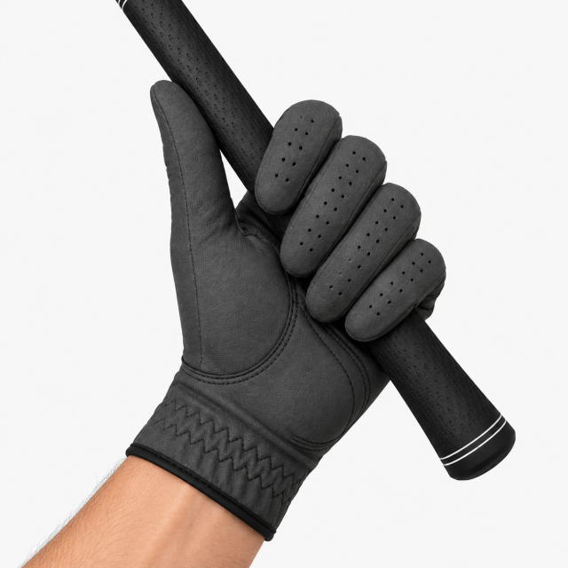 Black sheepskin golf glove gripping golf club with reinforced palm