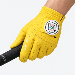 Yellow sheepskin golf glove gripping golf club with custom closure logo