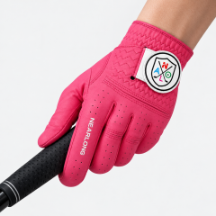 Hot pink sheepskin golf glove gripping golf club with custom closure logo