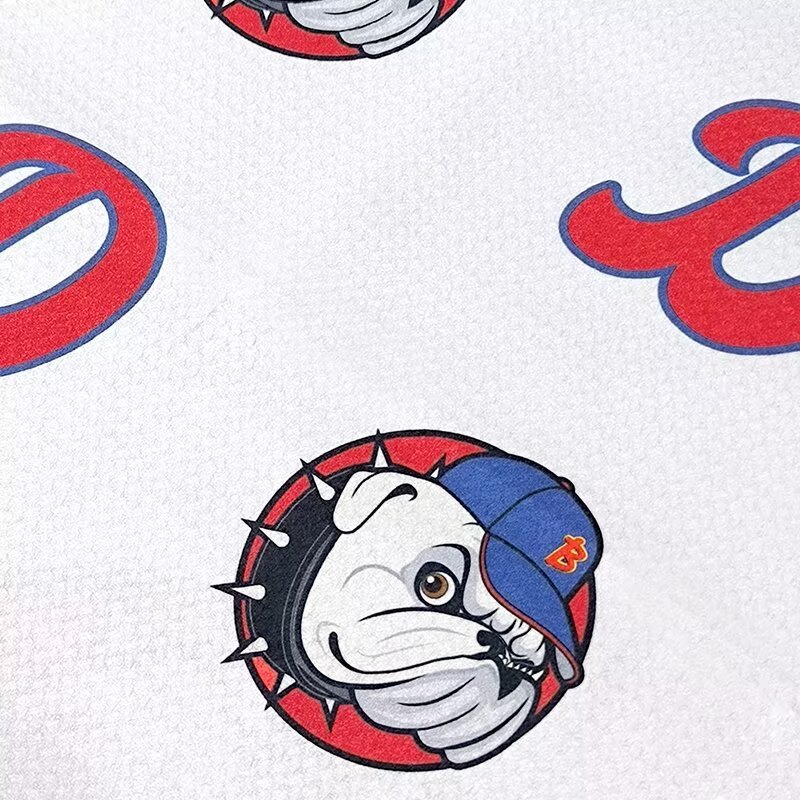 Custom printed golf towel close-up with bulldog logo pattern