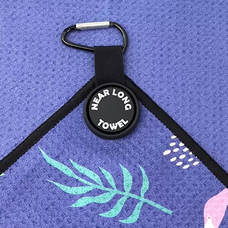 Women's golf towel with carabiner clip and branded attachment