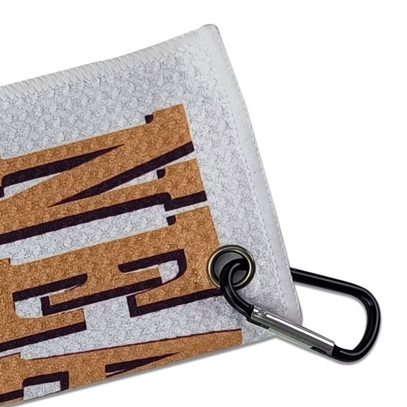 Golf towel with carabiner clip and reinforced metal grommet