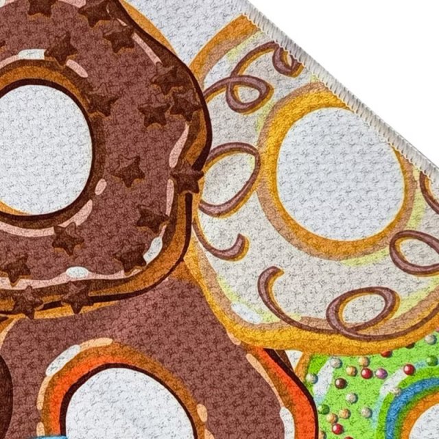 Custom printed golf towel with colorful donut pattern close-up