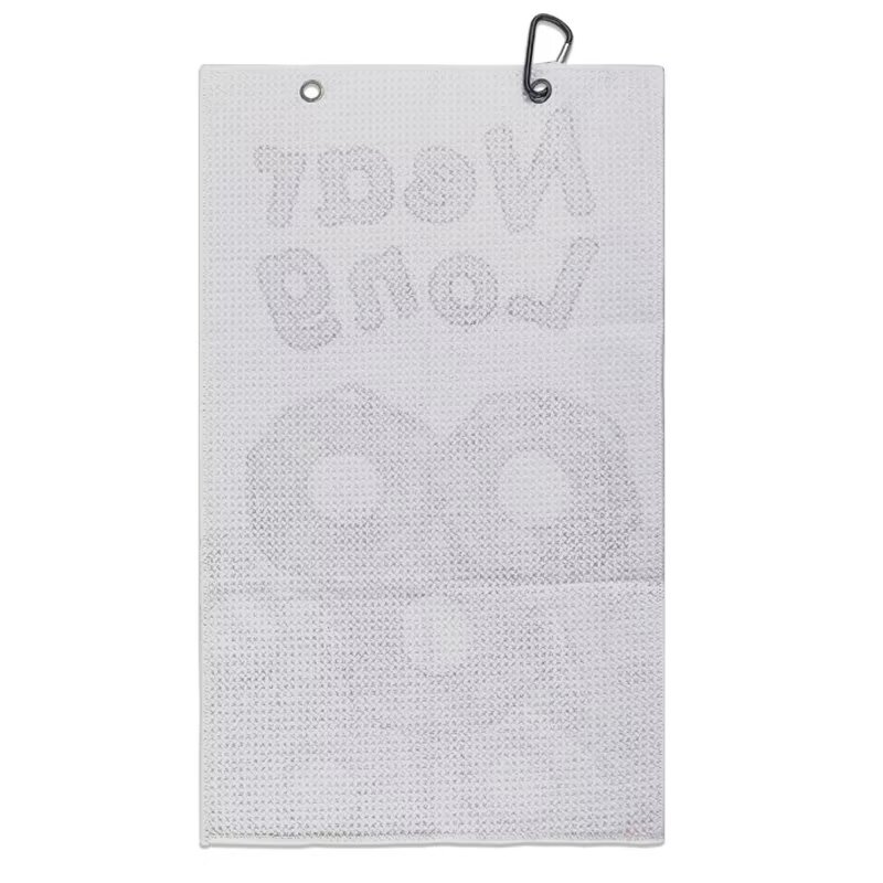 Textured golf towel reverse with metal grommets and clip