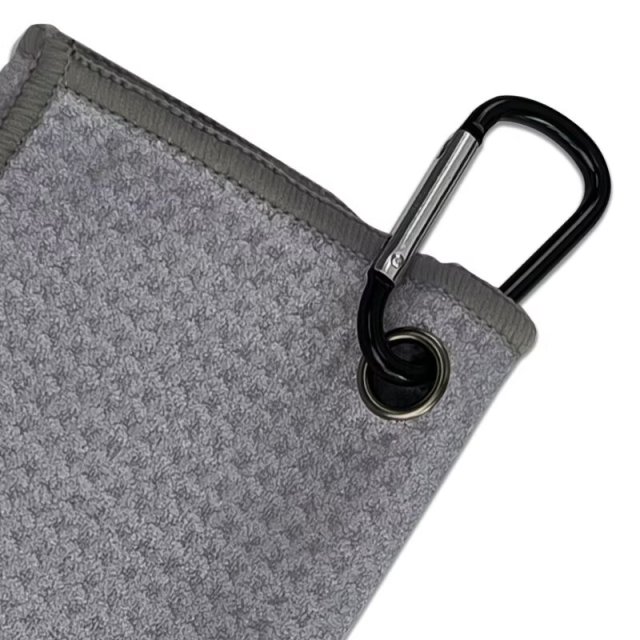 Golf towel with carabiner hook and reinforced metal grommet